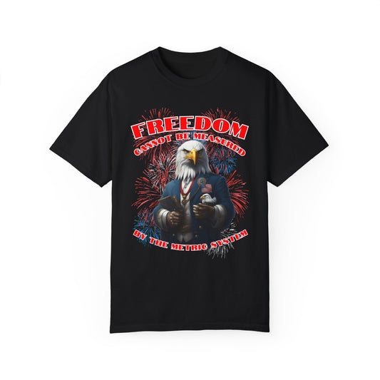 4TH OF JULY / INDEPENDENCE DAY T-SHIRT FEATURING A HUMANIZED BALD EAGLE HOLDING A TINY BALD EAGLE WITH THE WORDS "FREEDOM CANNOT BE MEASURED BY THE METRIC SYSTEM" AND A BACKGROUND OF FIREWORKS. IT'S FESTIVE. IT'S PATRIOTIC.