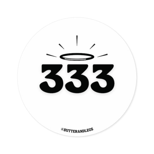 A WHITE STICKER FEATURING BLACK TEXT OF THE ANGEL NUMBERS "333" WITH A CUTE HALO ABOVE THEM