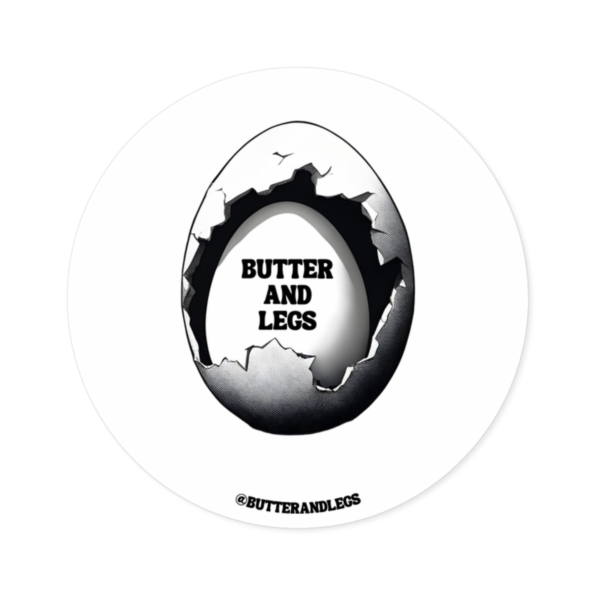 BUTTER AND LEGS LOGO STICKER FEATURING A PARTIALLY CRACKED EGG REVEALING ANOTHER EGG INSIDE WITH TEXT THAT READS "BUTTER AND LEGS" 